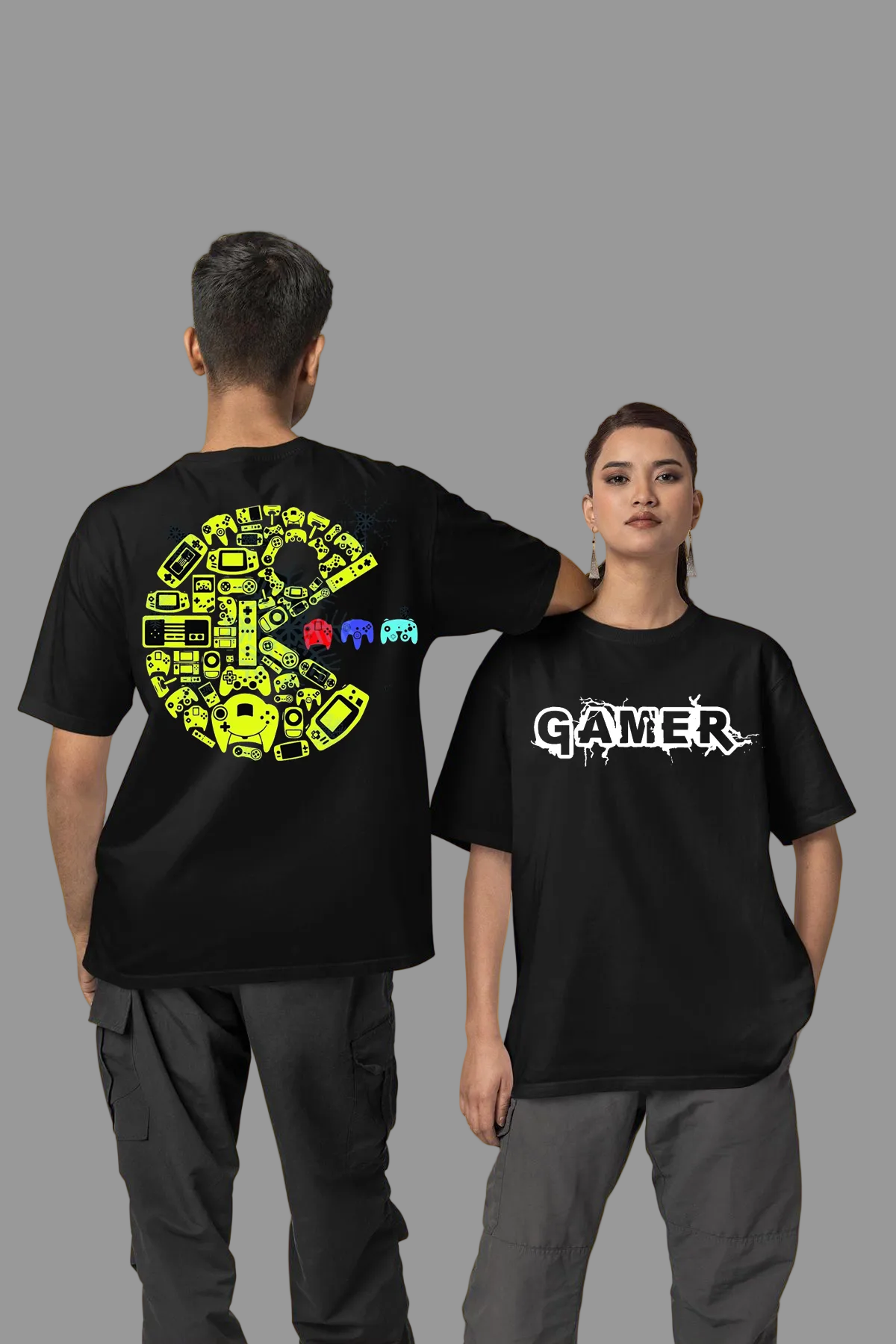 Two people wearing black t-shirts with colorful graphics and 'Gamer' text on a yellow background